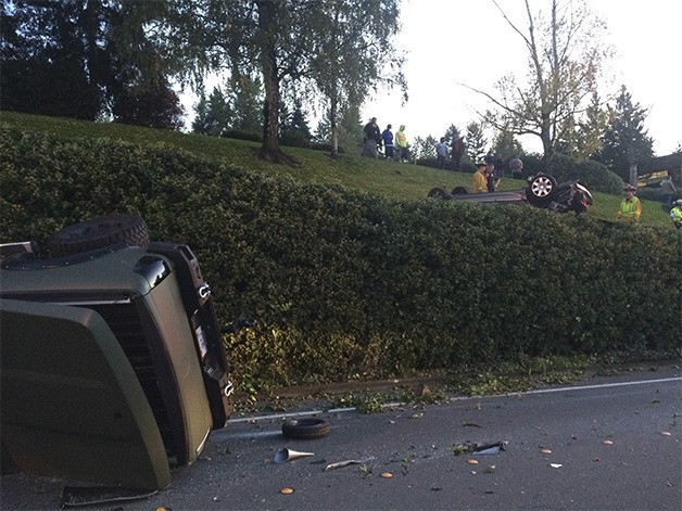 A photo distributed by Bellevue Police showing two upended vehicles