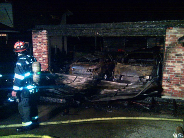 Two cars were destroyed by a garage fire in Newcastle Sunday night. No one was injured.