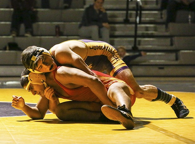 Issaquah 160-pounder Colby Starren battles with Newport's Humza Talat on Jan. 22 in Issaquah. Starren won the match via pin.
