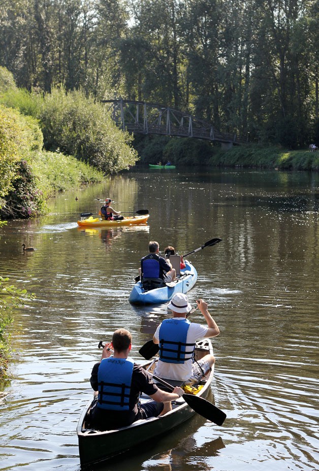 Students take to canoes to see how pollutants from the land around the Puget Sound are causing degradation of the Sammamish Slough.