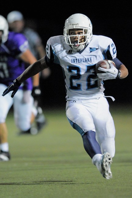 Saints RB Jordan Todd (22) breaks free for a long gain in the second half at Lake Washington High School in Kirkland on Friday.