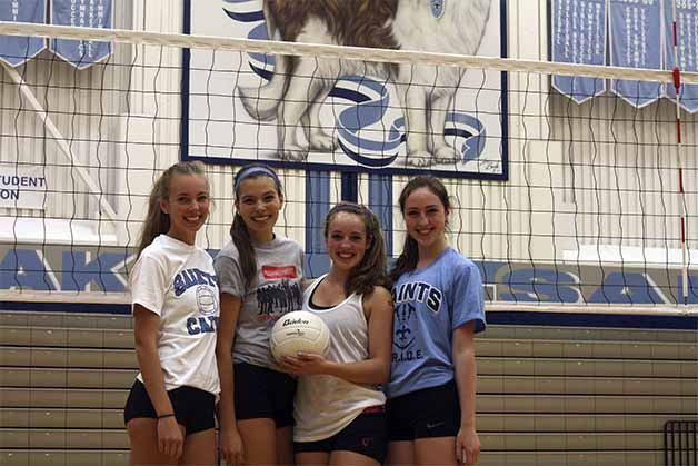(Left to right) Sisters Julia and Jacqueline Regalia and Isabelle and Melissa Long give Interlake's volleyball team a decidedly family feel.