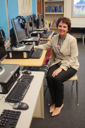 Bellevue School District Superintendent Amalia Cudeiro sits at a computer at Sammamish High School the week before school starts.