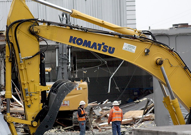 Demolition of the Barrier Porsche dealership began on the 11000 block of Northeast Eighth Street on Tuesday. T.J. Woosley tells the Reporter 'it's the end of an era