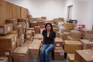 Yoko Sueyoshi sits amid the Tomoshibi library's 28