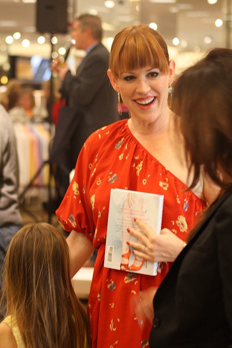 Molly Ringwald talks with an admirer at her talk and book signing at the Bellevue Nordstrom store Saturday