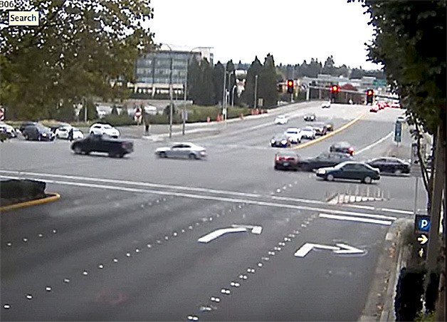 A still from police video shows the car being hit by the first of two cars after running a red light at the intersection of 112th Avenue and N.E. 8th St.