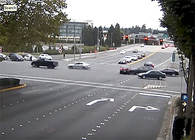 A still from police video shows the car being hit by the first of two cars after running a red light at the intersection of 112th Avenue and N.E. 8th St.