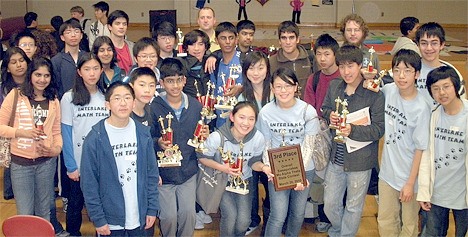 Mathelete members from Bellevue high schools show off their trophies.