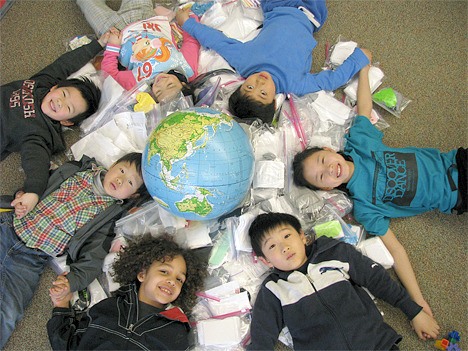 Students at Bellevue's Eastgate Elementary School link hands to show their support for a project that shipped 1
