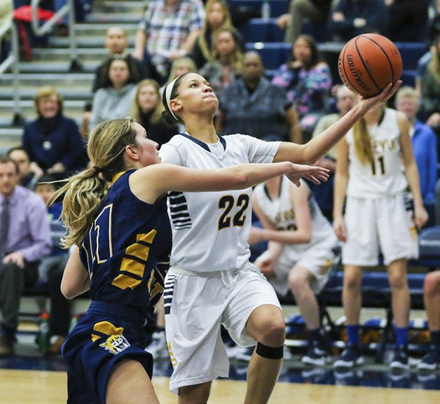 Bellevue Wolverines senior Anna Wilson drives to the basket against West Seattle on Feb. 18 at Bellevue College.