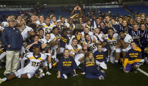 Bellevue players and coaches with the 3A state title trophy