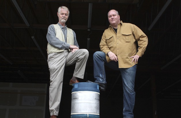 Scott Hansen (left) and John Robertson at the future site of Bellevue Brewing Co. The site remains unfinished