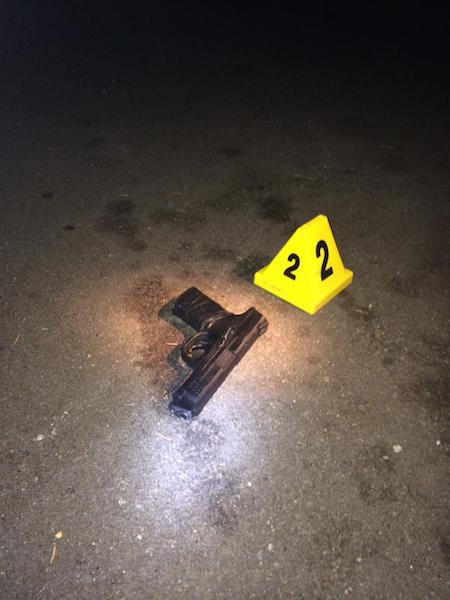 Police say a suspect shot at by an officer Friday night was carrying a pellet gun with the barrel drilled out to look like a real firearm.