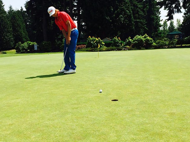 Sammamish Totems 2015 graduate Matt Marrese sinks a putt while perfecting his form on June 22 at Fairwood Golf and Country Club in Renton. Marrese will continue his golf career at the University of Washington this fall.