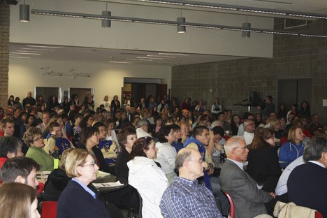 A crowd filled the Sammamish High cafeteria beyond capacity Thursday night as the Bellevue School District held a forum on budget cuts.