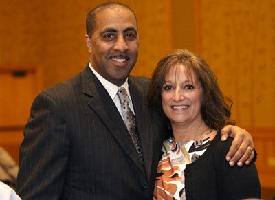 Huskies basketball Coach Lorenzo Romar and YES client Shari Silva-Compton. Both were speakers at the annual Invest in Youth Breakfast.