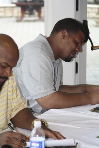 Seattle Seahawks Running Back TJ Duckett (left) and Offensive Tackle Sean Locklear (right) sign autographs for fans at the Drive for Dreams Golf Tournament and Awards Dinner benefiting Overlake Service League.