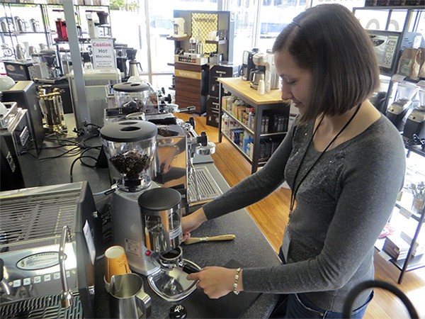 Seattle Coffee Gear employee Dori Lowman brews a shot of espresso inside the recently-opened downtown Bellevue store.