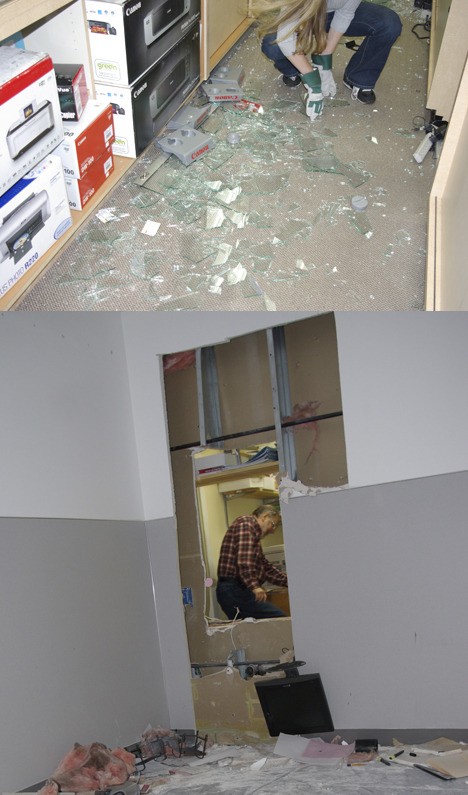 Top: An employee at Omega Photo cleans up broken glass from a shattered display case