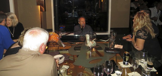 Jim Washburn in his signature spot behind the piano in the Daniel's Broiler-Bellevue lounge.