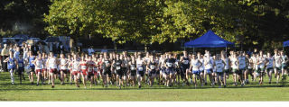 The Bellevue Christian boys (front center) emerge from the pack during the start of Wednesday’s league championship meet at Kelsey Creek. Both the boys and girls teams from Bellevue Christian won the meet. It was the third-straight championship for the BCS boys.