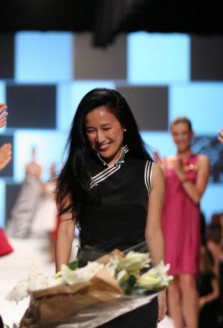 Designer Luly Yang is applauded at the conclusion of her fundraising fashion show that benefited Camp Korey.