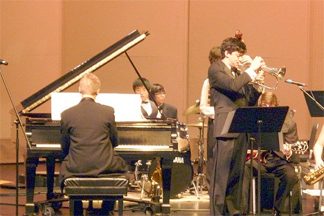 Brian Lawrence on piano accompanies Nolan Tsang on flugelhorn playing 'Then and Now.'