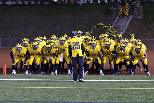 Bellevue players prepare before a game this season as injured senior captain Ari Morales leads.