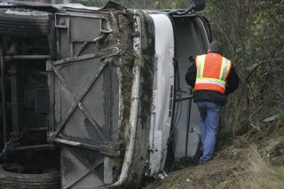 The front windshield of the bus carrying members of the Bellevue High School football team was shattered when it flipped Friday morning on I-5. Team members and coaches crawled through the opening to escape from the bus.