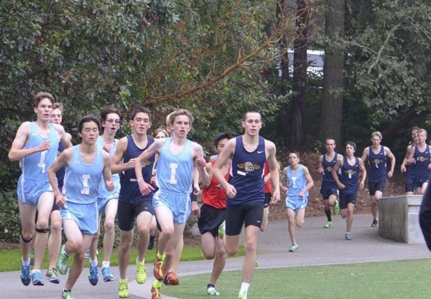 Interlake sophomore Luke Beauchamp (center) has paced the Saints this year and helped the team to next week's district meet with a team scoring title at the KingCo championships.