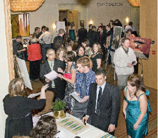 Guests at the fundraising event for Rwanda sign in and have a chance to bid on items in a silent auction.