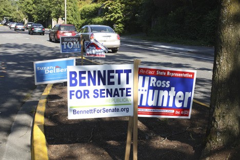 Campaign signs are beginning to clutter the landscaped medians along NE Eighth Street in Bellevue.