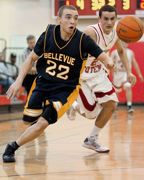 Wolverine guard Aaron Bright (22) steals a ball from Totems Daniel Wruble during a game at Sammamish on Tuesday. Bellevue won 70-60.