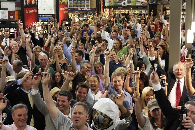 Hundreds of people - including Attorney General Candidate Reagan Dunn (bottom left) - gathered at Total Wine and More to attempt to break the world record for most bottles of wine uncorked simultaneously.
