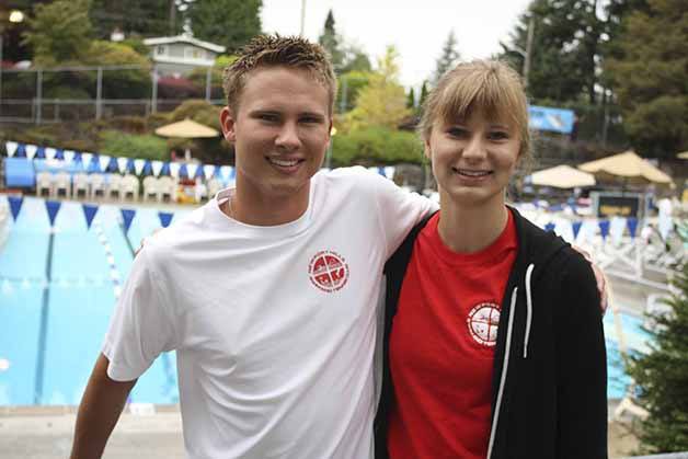 Kyle Nelson and Amy LeBar stand near the pools at Newport Hills Swim and Tennis Club