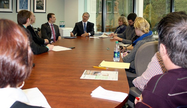 Gov. Jay Inslee talks to members of Sound Publishing at an editorial board meeting Friday
