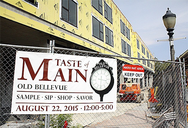 A sign advertising the annual Taste of Main event hung on chain link fencing surrounding the Main Street Gateway project construction.