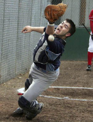 Interlake catcher Spencer Nelson goes after a foul ball against Newport.