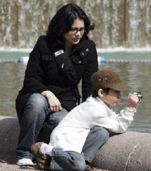 Luca Chang takes photos of ducks as his aunt