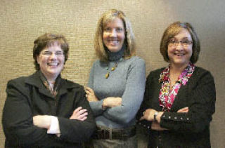 Bellevue-based Gallagher Benefit Services of Washington employees and baby boomers (from left) Nita Petry