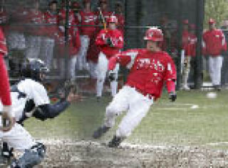 Newport’s Will Pierce slides into home in a game against Bellevue.