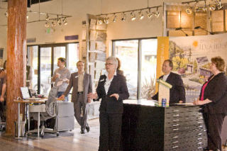 Zero Energy Idea House owner Donna Shirey (front) talks about the project as David Clinkston (left) of Clinkston Brunner Architects; Riley Shirey