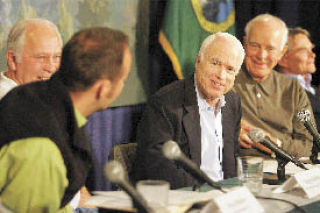 Republican presidential candidate John McCain interacts with a panel of Washington government