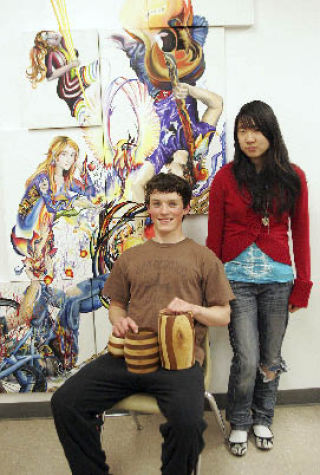 Matt Ruddell (seated) and Jessie Chen show their artistic talents at Sammamish High School.