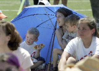 Mindy Leffler with Aidan in her lap