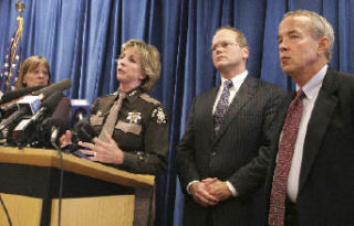 Sheriff Sue Rahr speaks as District Court Presiding Judge Barbara Linde