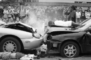 Sammamish High School student actors react to a fatal automotive collision scene during a DUI reenactment coordinated by the Bellevue Fire Department on Thursday