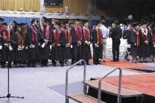 Sammamish students file into the Bellevue Community College gymnasium in preparation for their graduation ceremony.