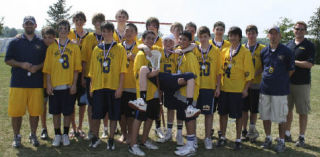 Players and coaches of the Bellevue Blue lacrosse team celebrate after taking second in an East Coast tournament.